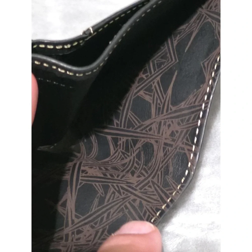 Cole Haan Black Bifold Men's Wallet with Emblem Logo and Outside Design